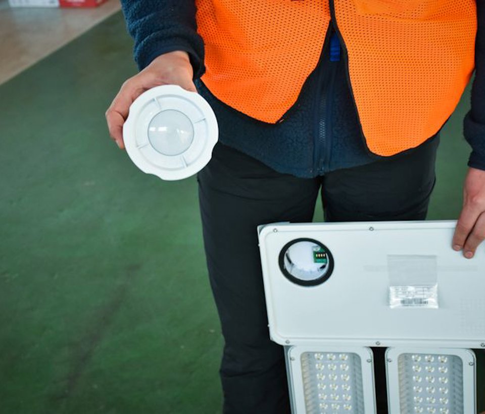 a person holding a white disc