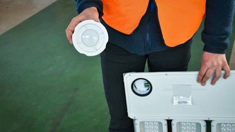 a person holding a white disc