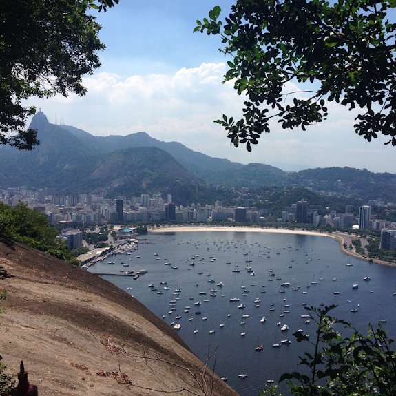 a beach with a city in the background