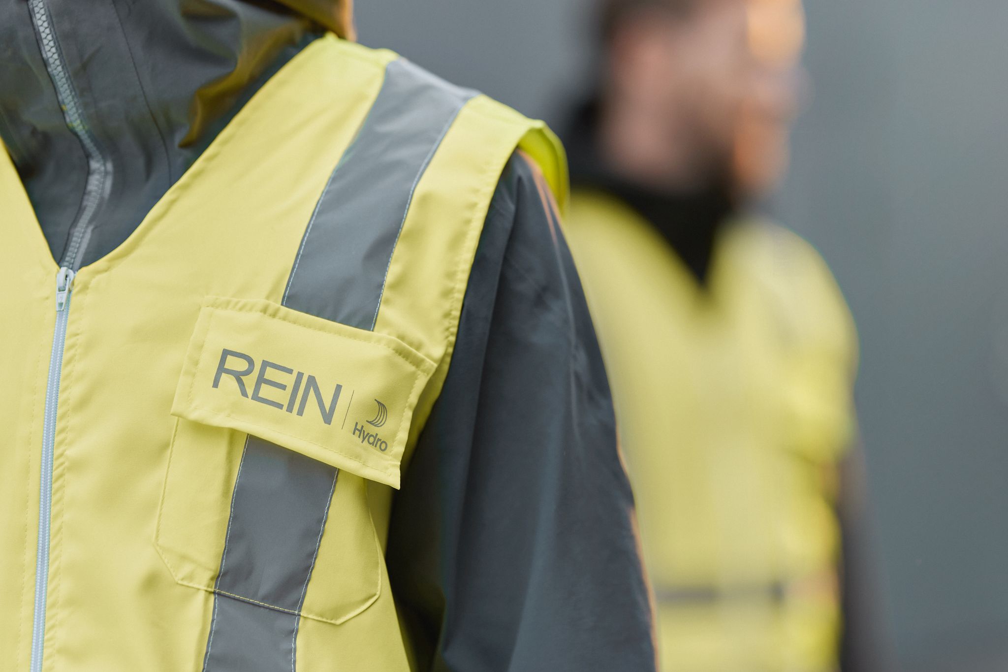 a person wearing a yellow jacket