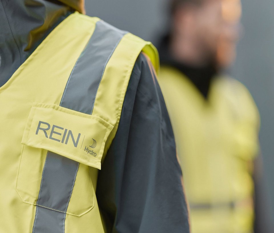 a person wearing a yellow jacket