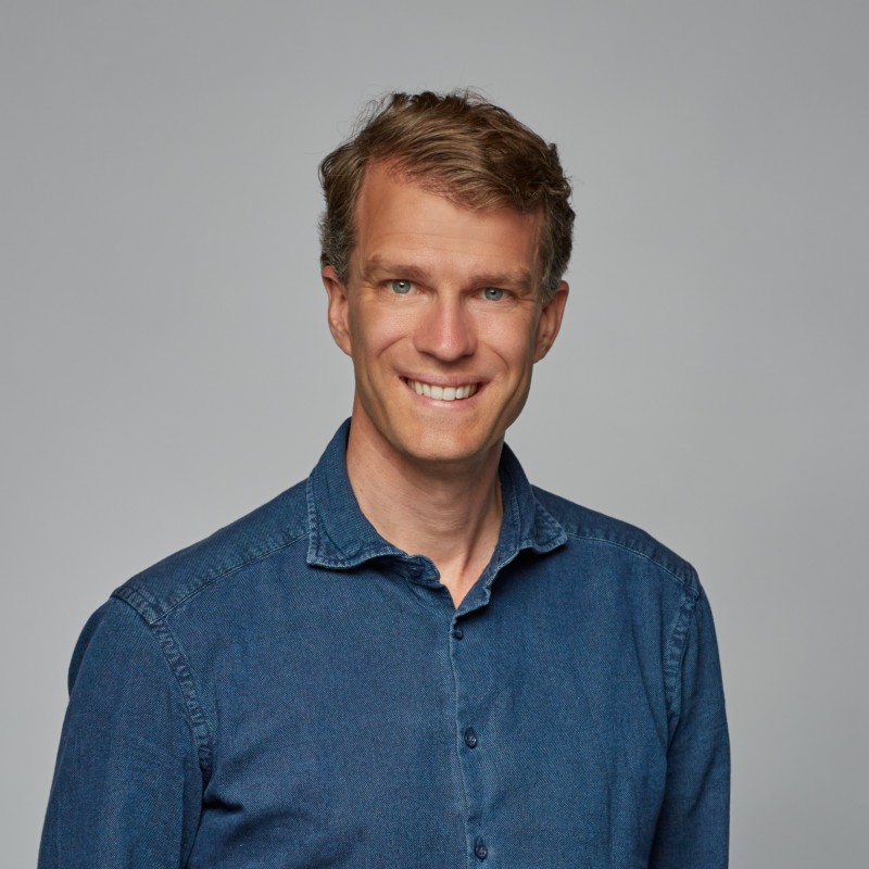 a man smiling at the camera