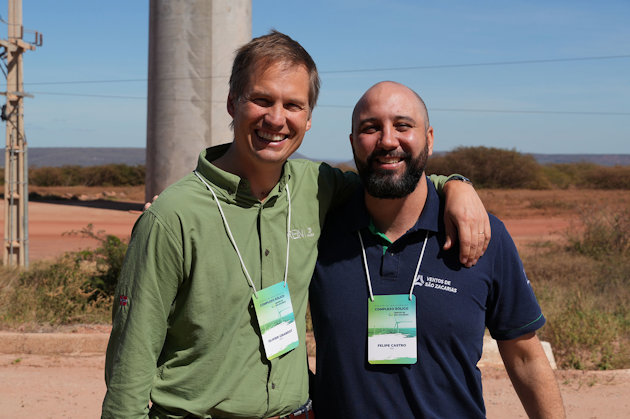 a couple of men posing for the camera