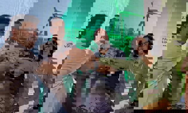 a group of people sitting at a table