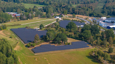 a landscape with trees and buildings